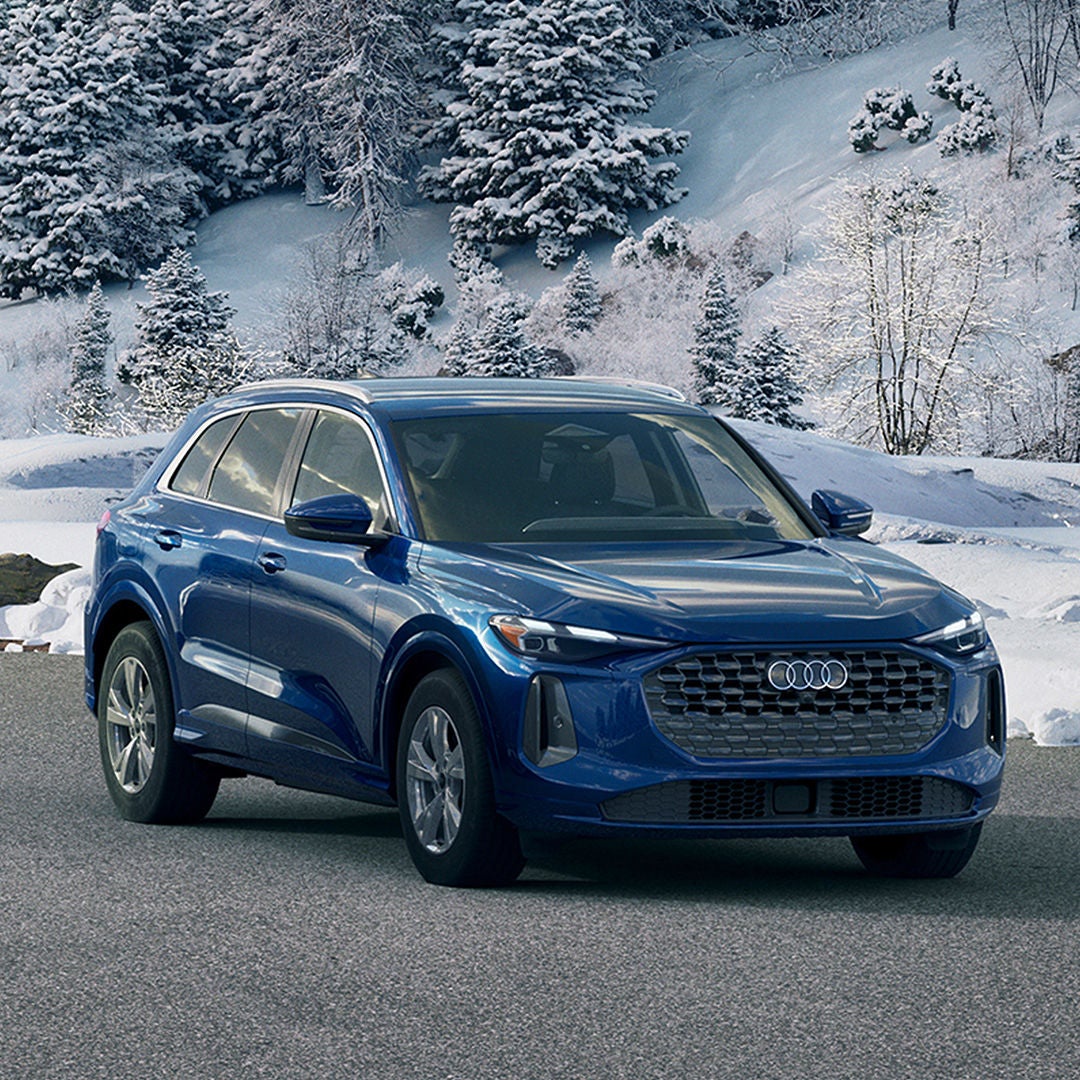 Right profile view of an Audi Q5 parked.